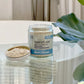 clear jar of a face mask, labeled Camouflage. on a glass table 