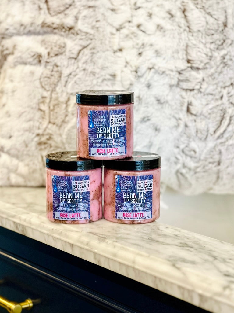 scrubs stacked on a counter pink and brown it says bean me up scotty rose latte