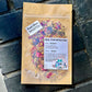 facial steam brighten with herbs in a brown see through bag. 