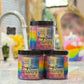 Three jars of 'Ding Queen' on a kitchen counter with blurred background