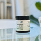 black jar on counter labeled Hot Mess, Itchy Scalp Treatment 