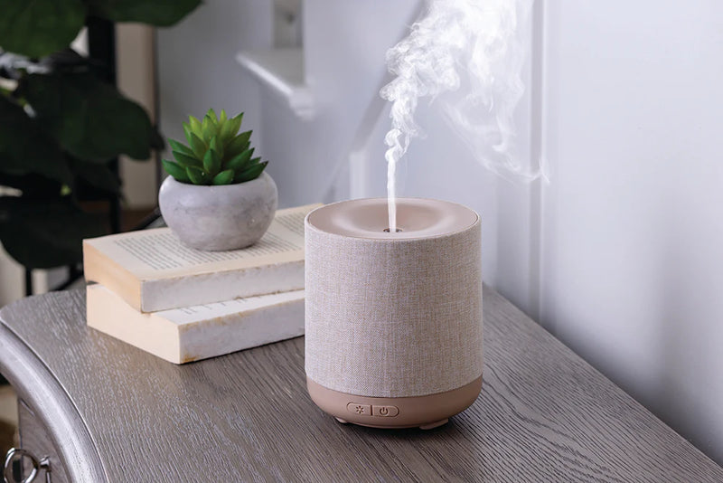 Natural linen ultrasonic essential oil diffuser on a hallway table, Good Common Sense Naturals