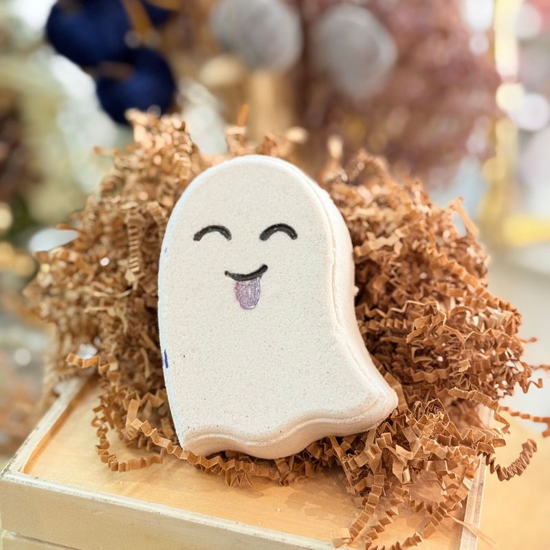 Ghosted bath bomb shaped like a ghost, dissolving into layered colors as it fizzes in water, Good Common Sense Naturals