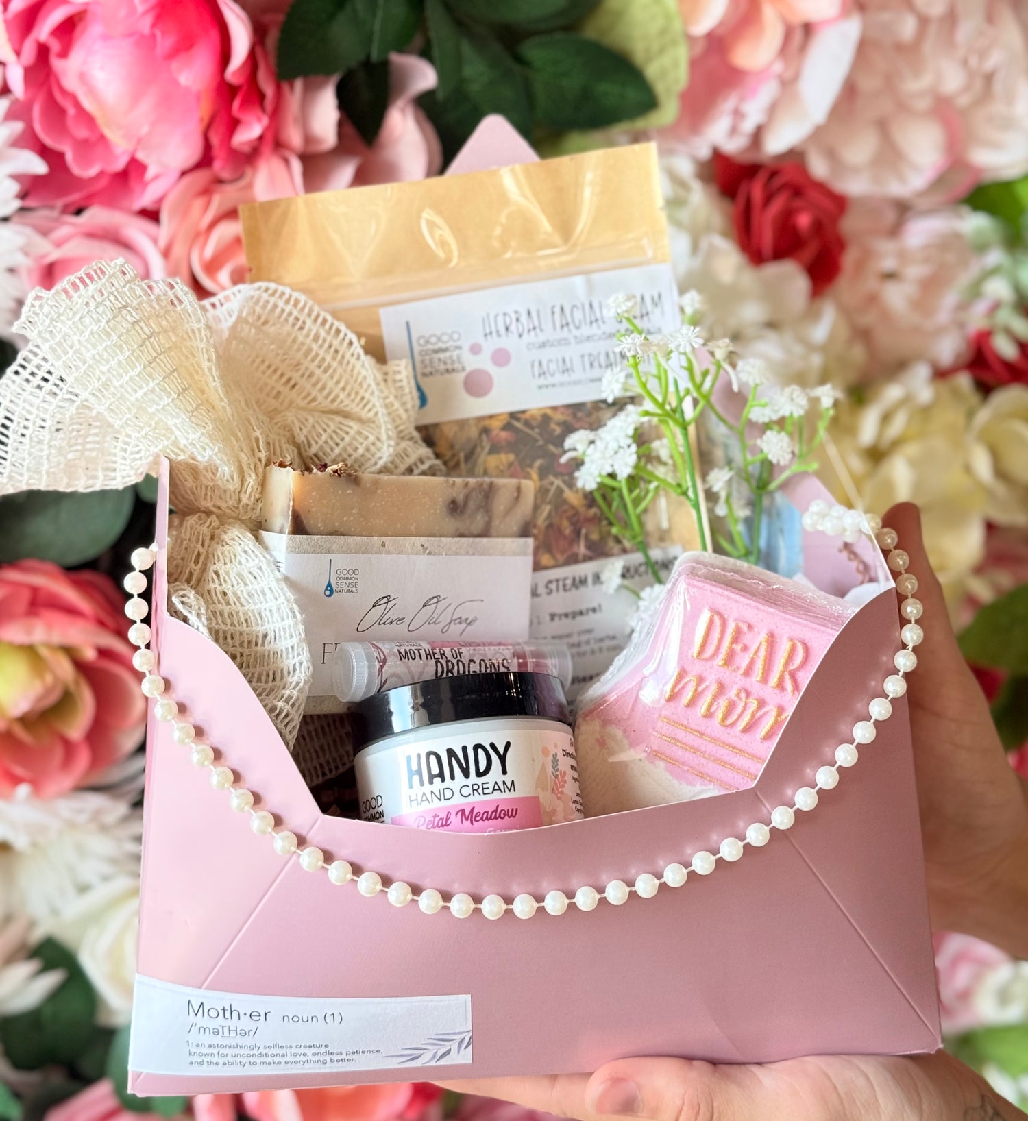 Gift basket with skincare products and decorative elements against a floral background