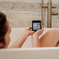 girl in tub blured holding the exorcist scrub up with hands.