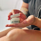 girl holding a mini oh my buttah jar 