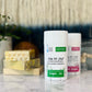 A container of The Pit Stop Natural Deodorant with Eucalyptus + Lime label, placed on a marble surface with a decorative background.