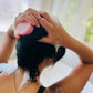 conditioner bar in use. girl using bar in shower. 