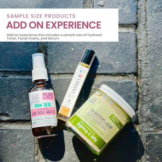 three sample products for an add on experience, raw deal rose water, vibrance serum, and a grain mask. on black bricked backround  