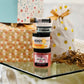 4oz Buff My Soul, 2 oz Handy, 1.5 oz Swamp Thing, and Lip Balm, stacked on a glass table