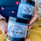 women holding two blue sugar scrubs labeled buff my soul