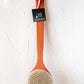 Long Handle Dry Brush leaning on a wall