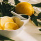 Eucalyptus and lemon in bowls on white counter top